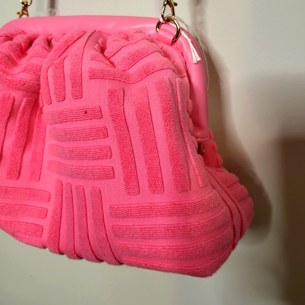 Hot pink clutch bag by Urban designs with long strap very soft material